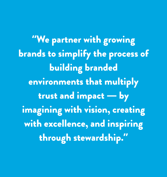 White quote text on a blue background about partnering with growing brands to build branded environments.