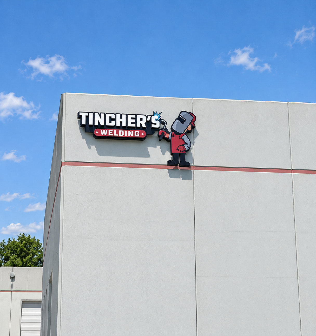 Tincher’s Welding sign on a gray building under a blue sky, with a cartoon welder mascot.