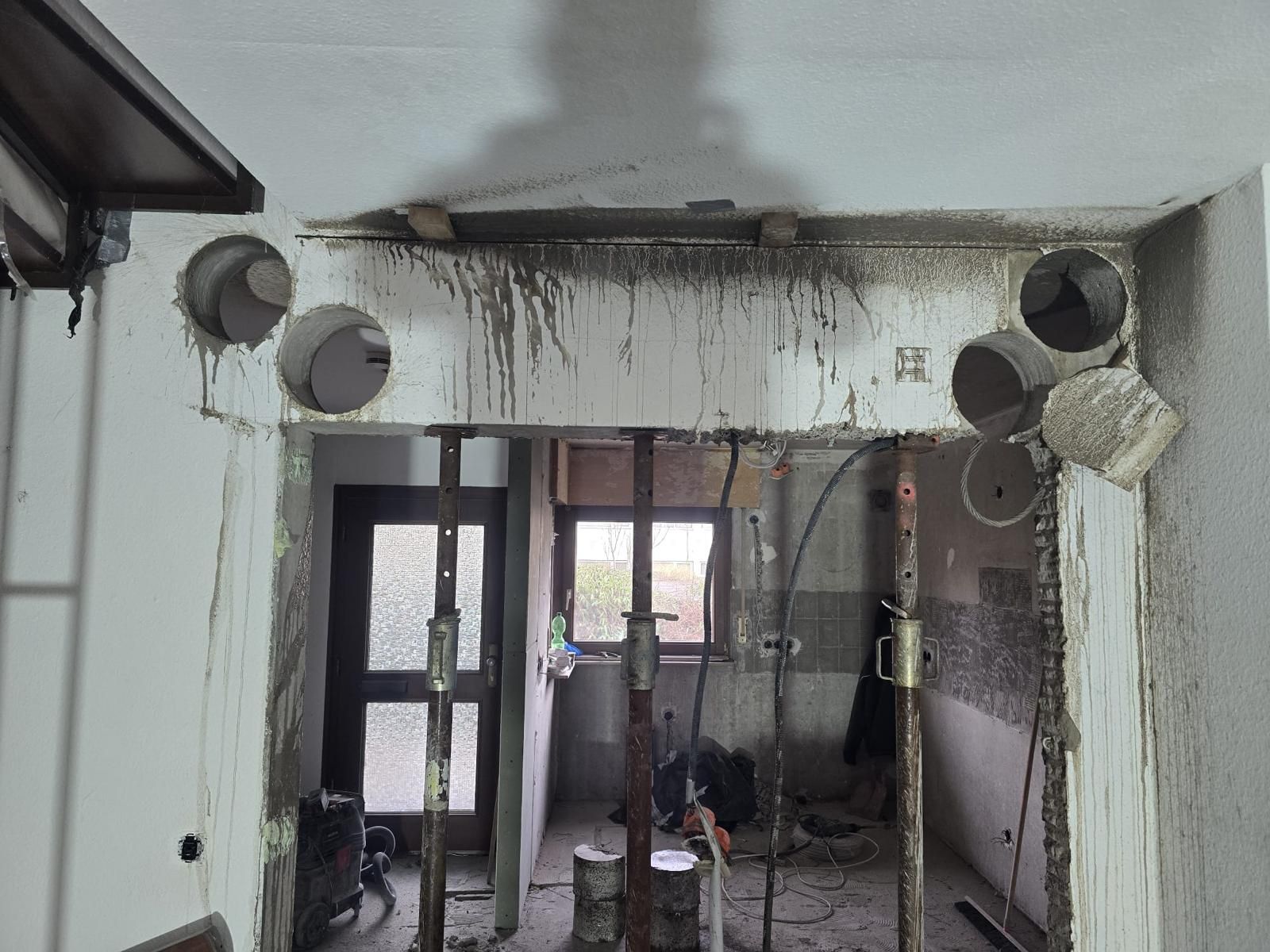 A room that is being remodeled with holes in the wall.