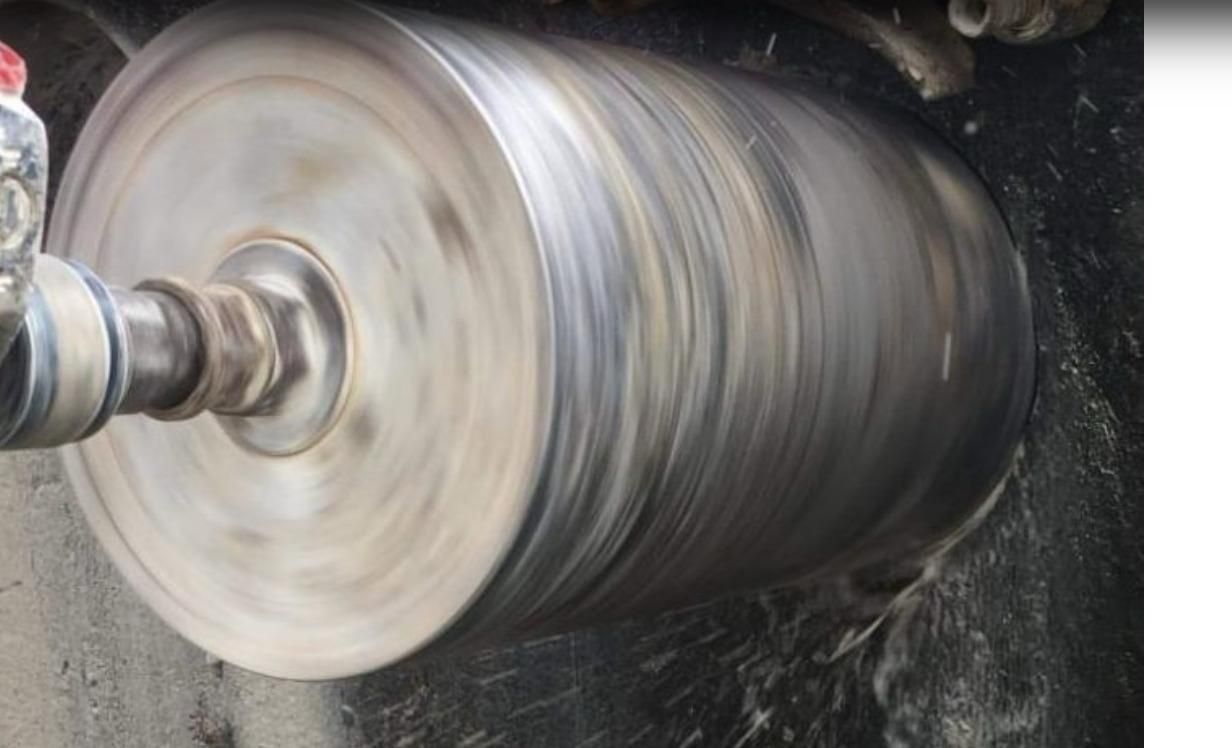 A large metal object is being drilled into the ground.