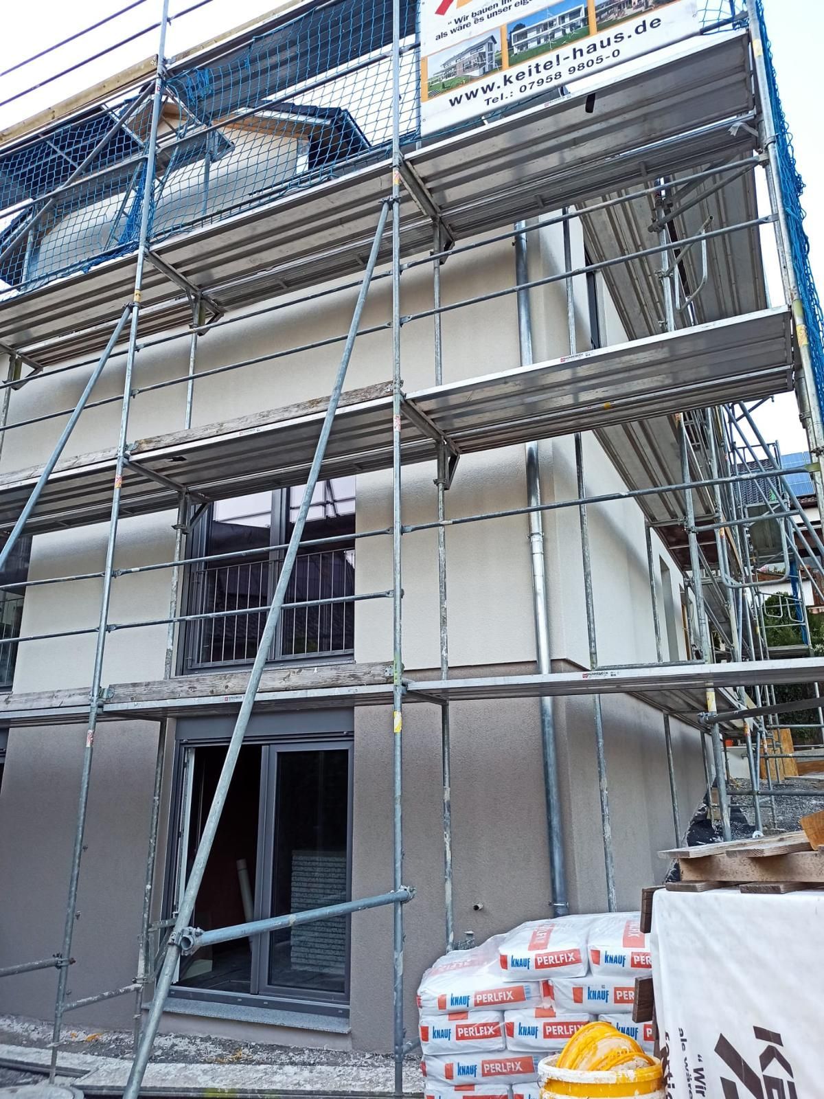 A building is being built with scaffolding around it.
