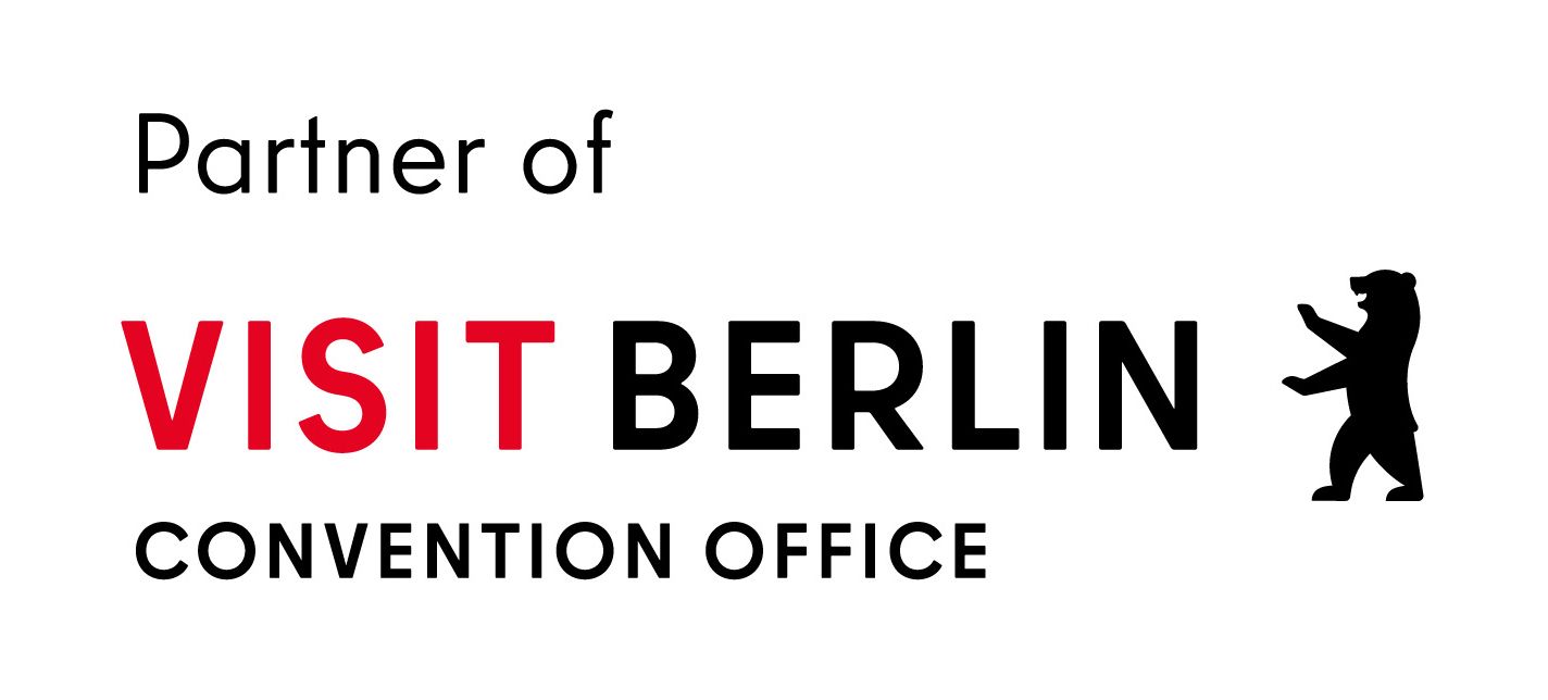Das Logo des Visit Berlin Convention Office enthält Text, ein rotes „VISIT“ und einen schwarzen Bären.