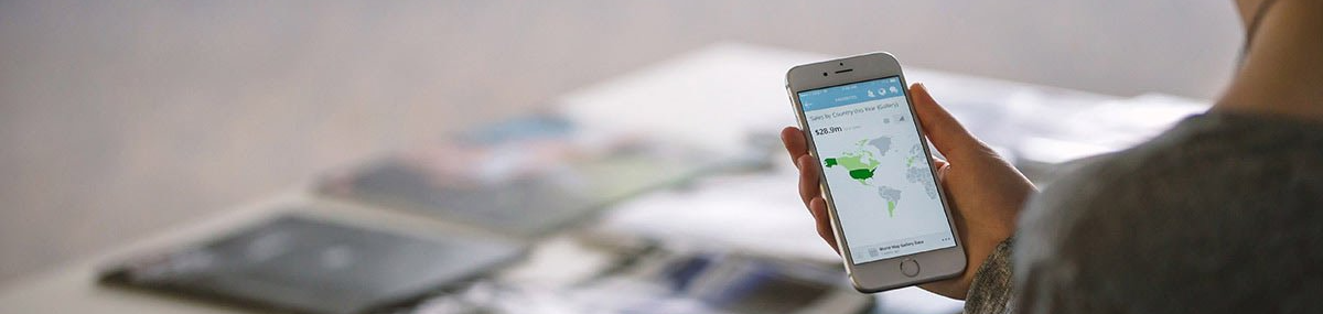 A person is holding a cell phone in their hand.