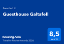 A blue Booking.com award graphic for Guesthouse Galtafell, showing a score of 8.5 out of 10 for the year 2026.