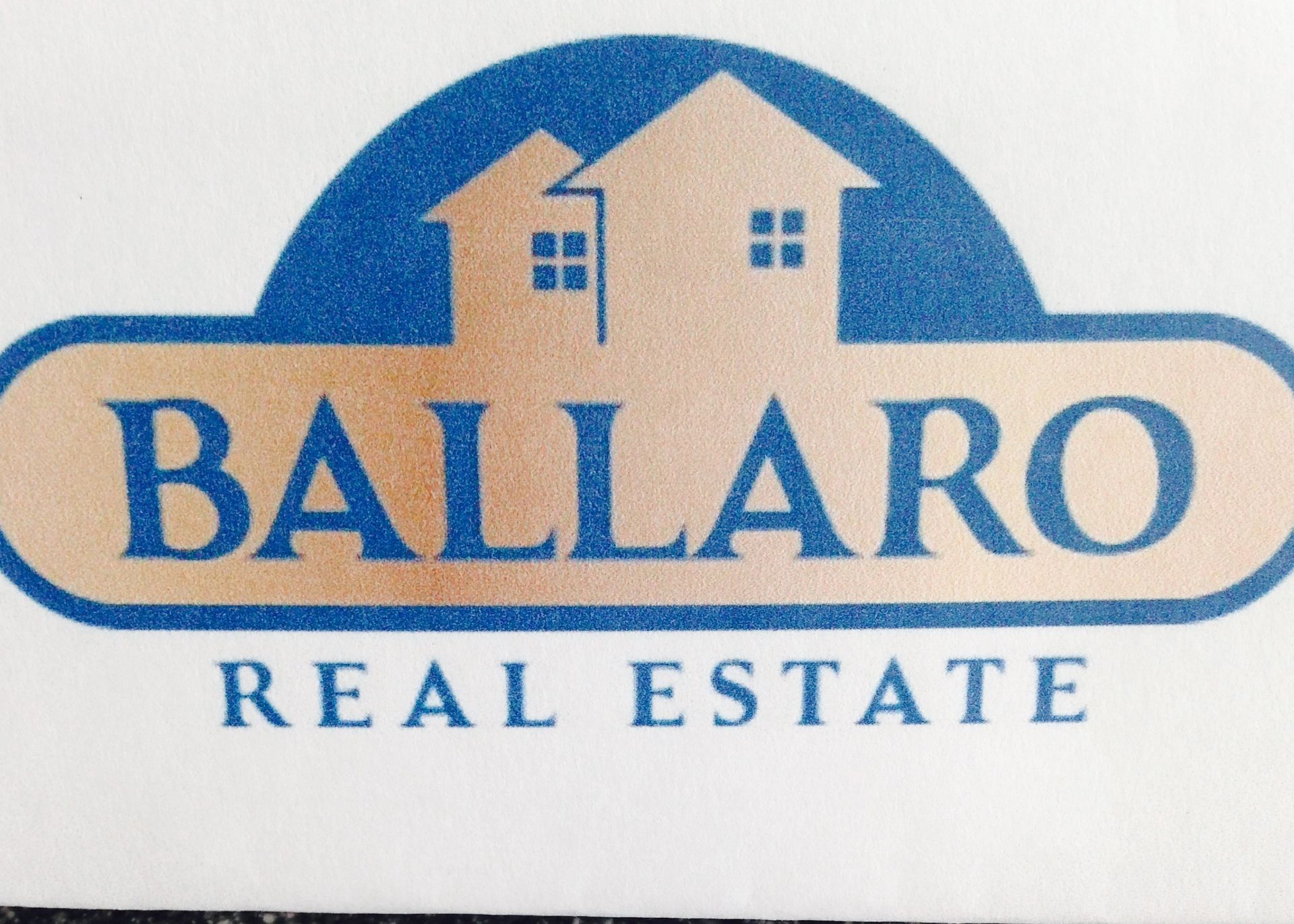 Logo for Ballaro Real Estate: Blue and gold houses in a blue arch above text.