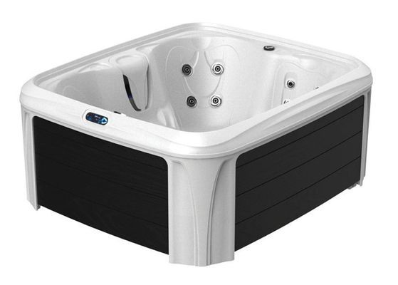 White and black corner hot tub with silver jets and blue control panel