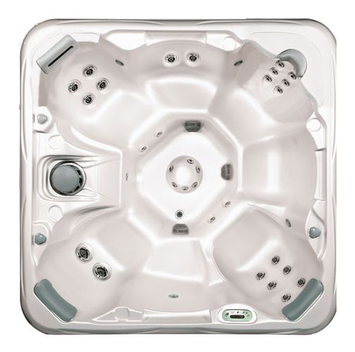 White hot tub spa with built-in seats, multiple jets, and a black control panel on the side.