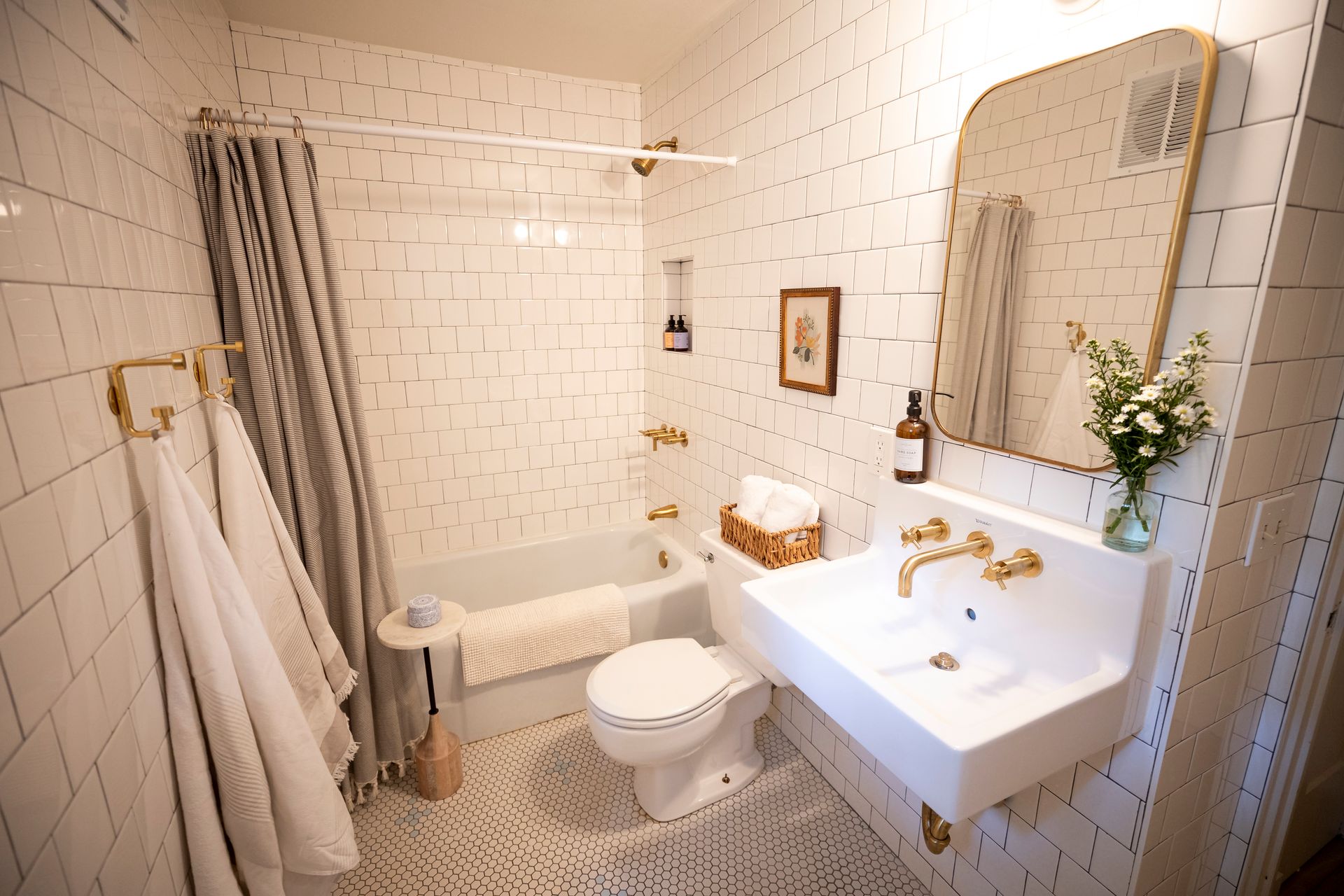 A bathroom with a sink toilet and bathtub