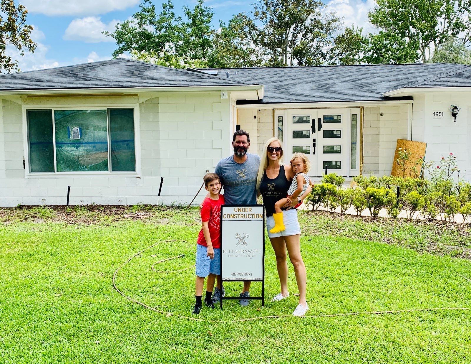 BittnerSweet Co. founders and their family posing in front of a white house with an