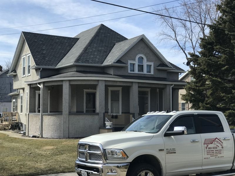 Service Truck in Front of Residential House — Oglesby, IL — H & S Contracting Inc.