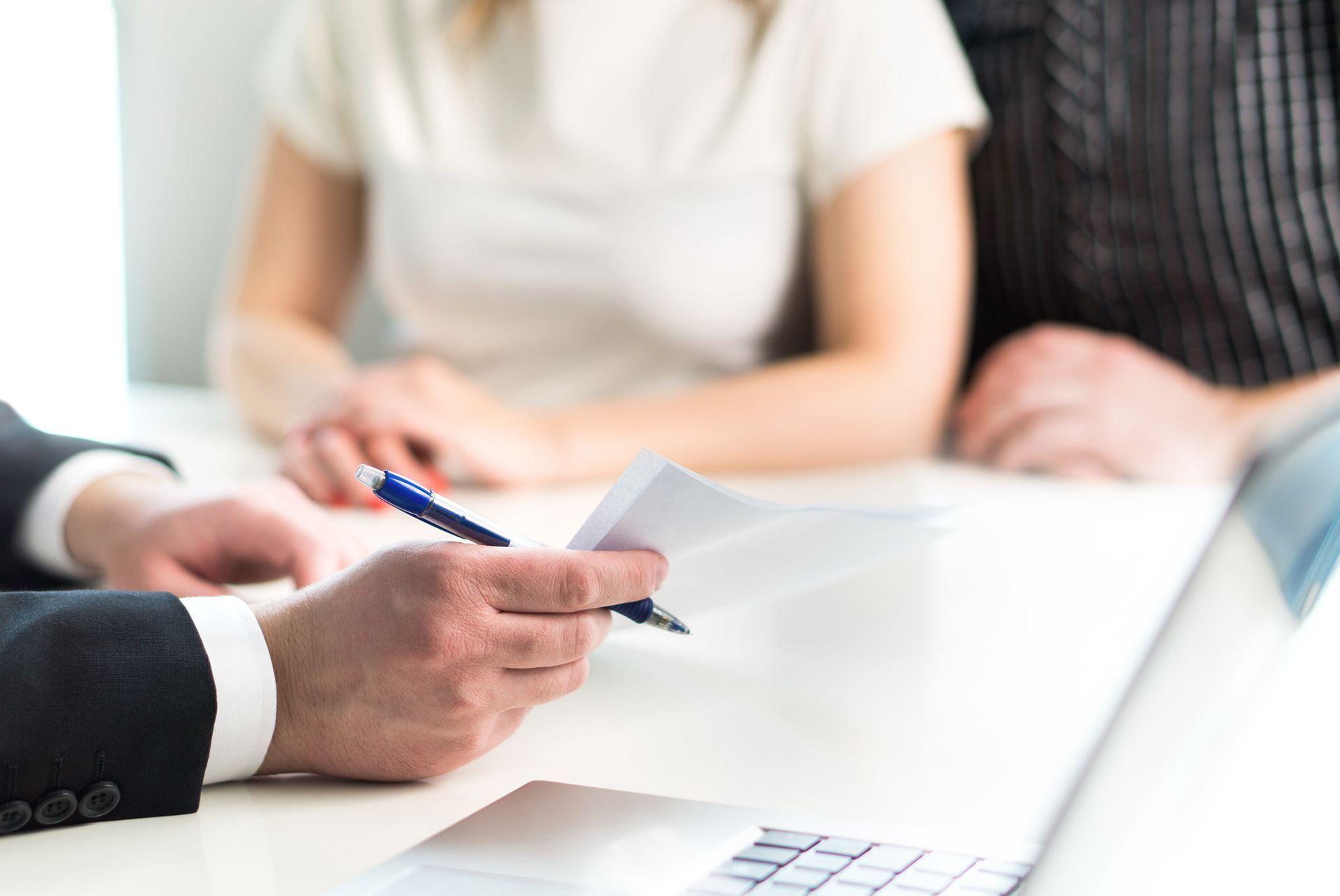 lawyer advising a couple during a legal consultation