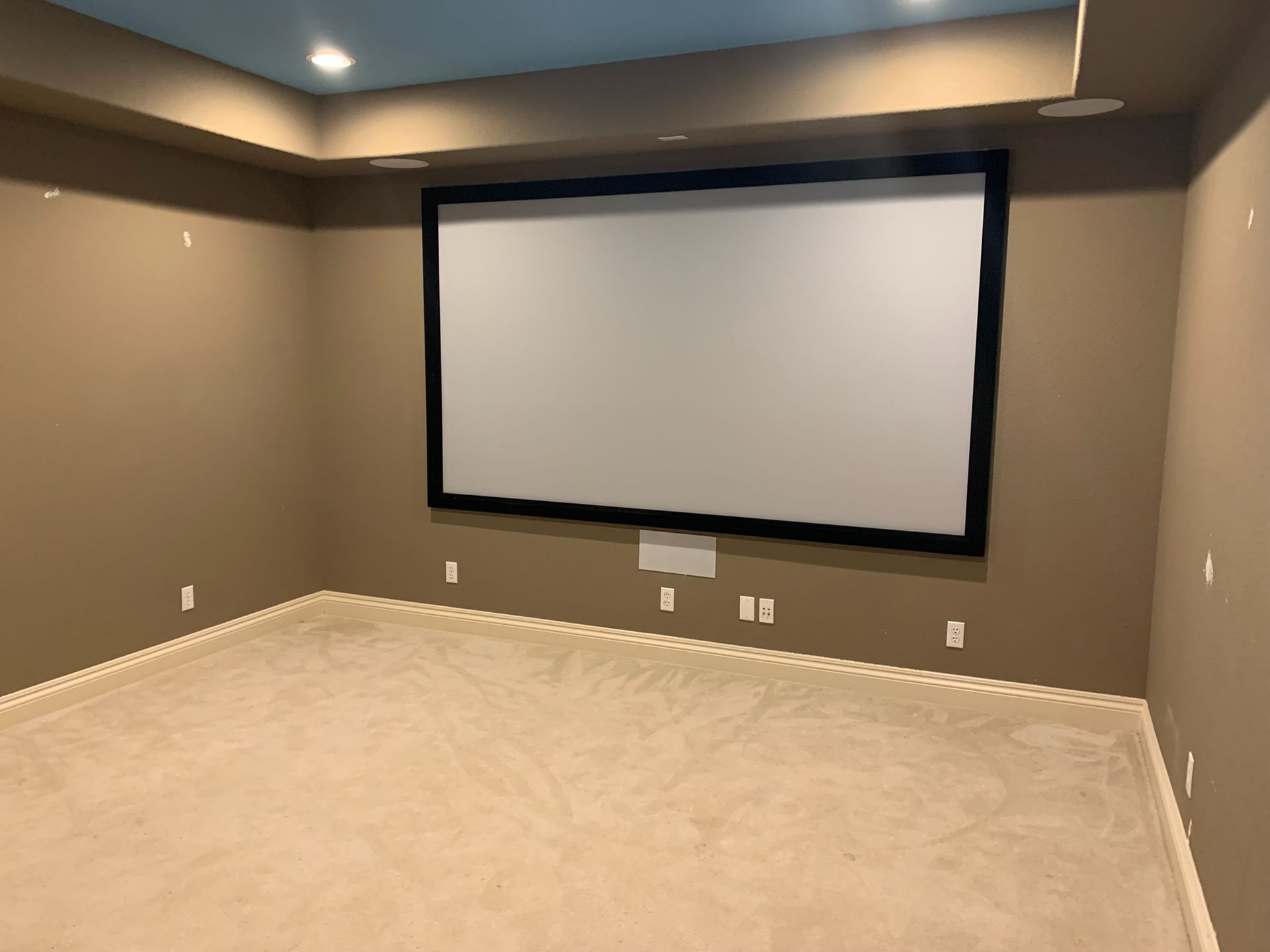 There is a large screen in the middle of the room.