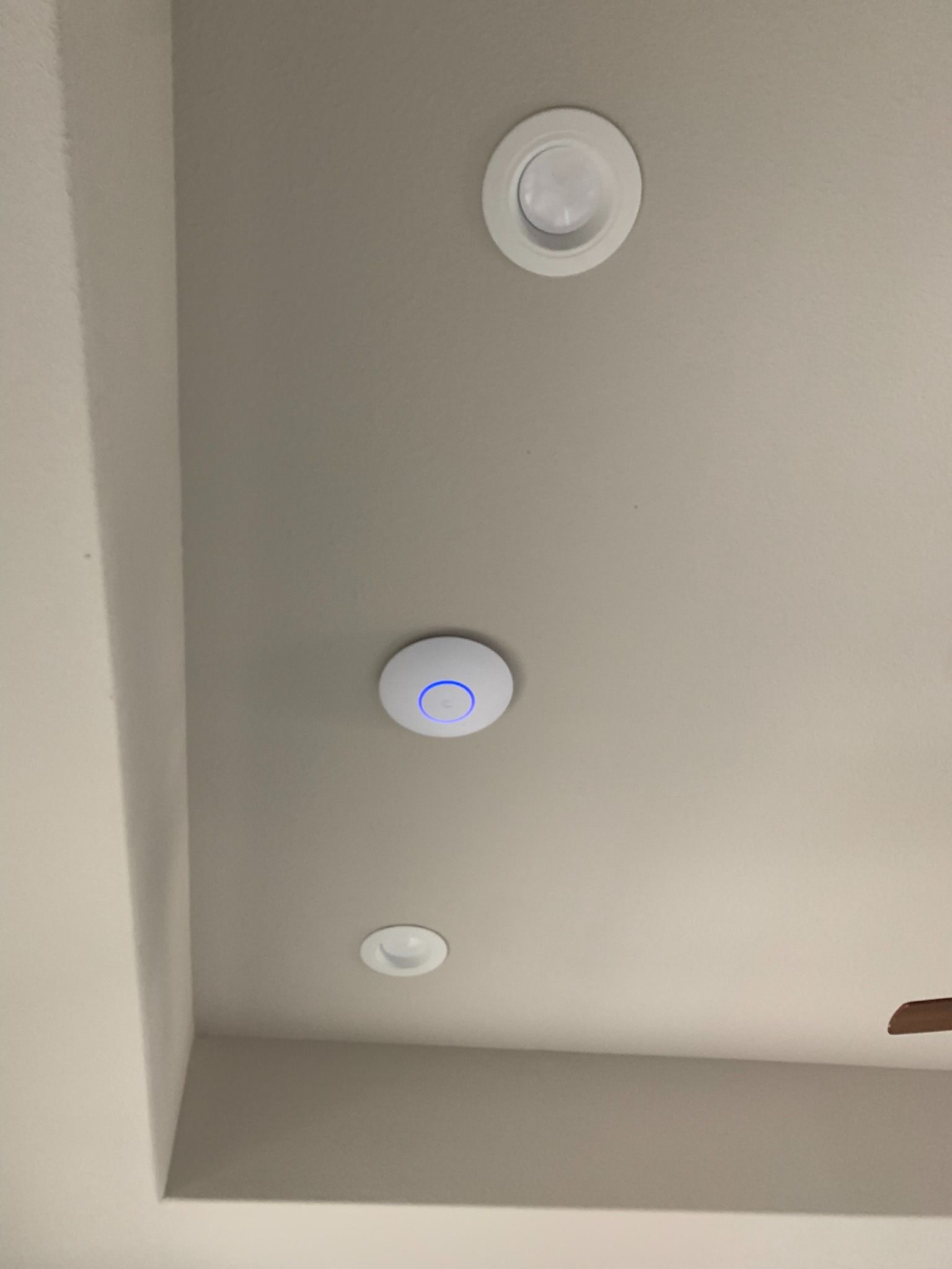 A ceiling with three lights hanging from it.