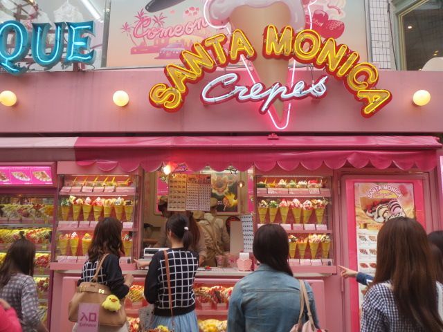 Pink Santa Monica Crepes storefront with three customers standing at the counter
