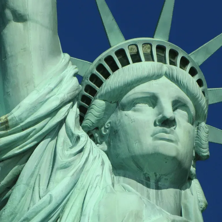 Close-up of the Statue of Liberty against a clear blue sky