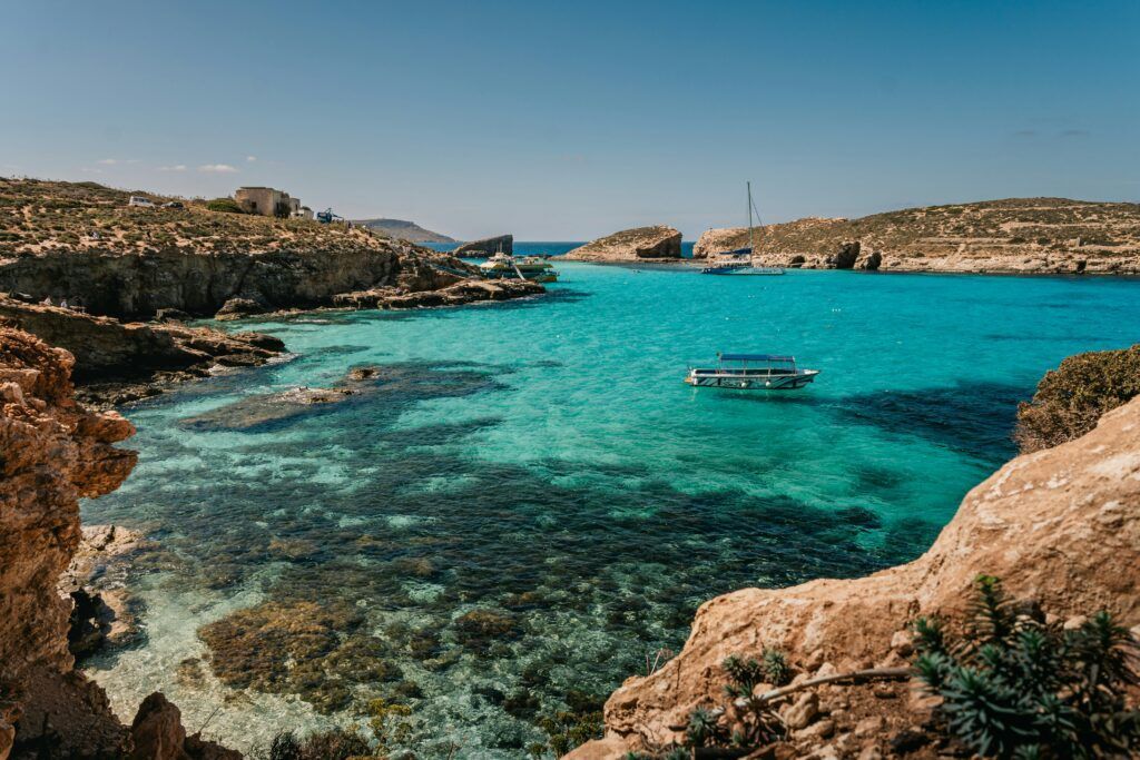 Turquoise bay between rocky cliffs under a clear sky