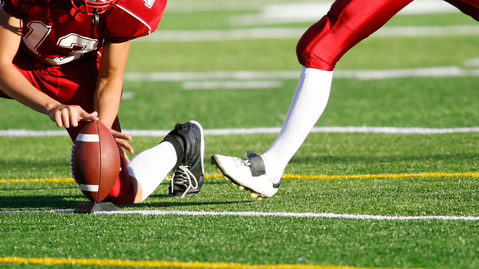 NFL player about to kick the ball