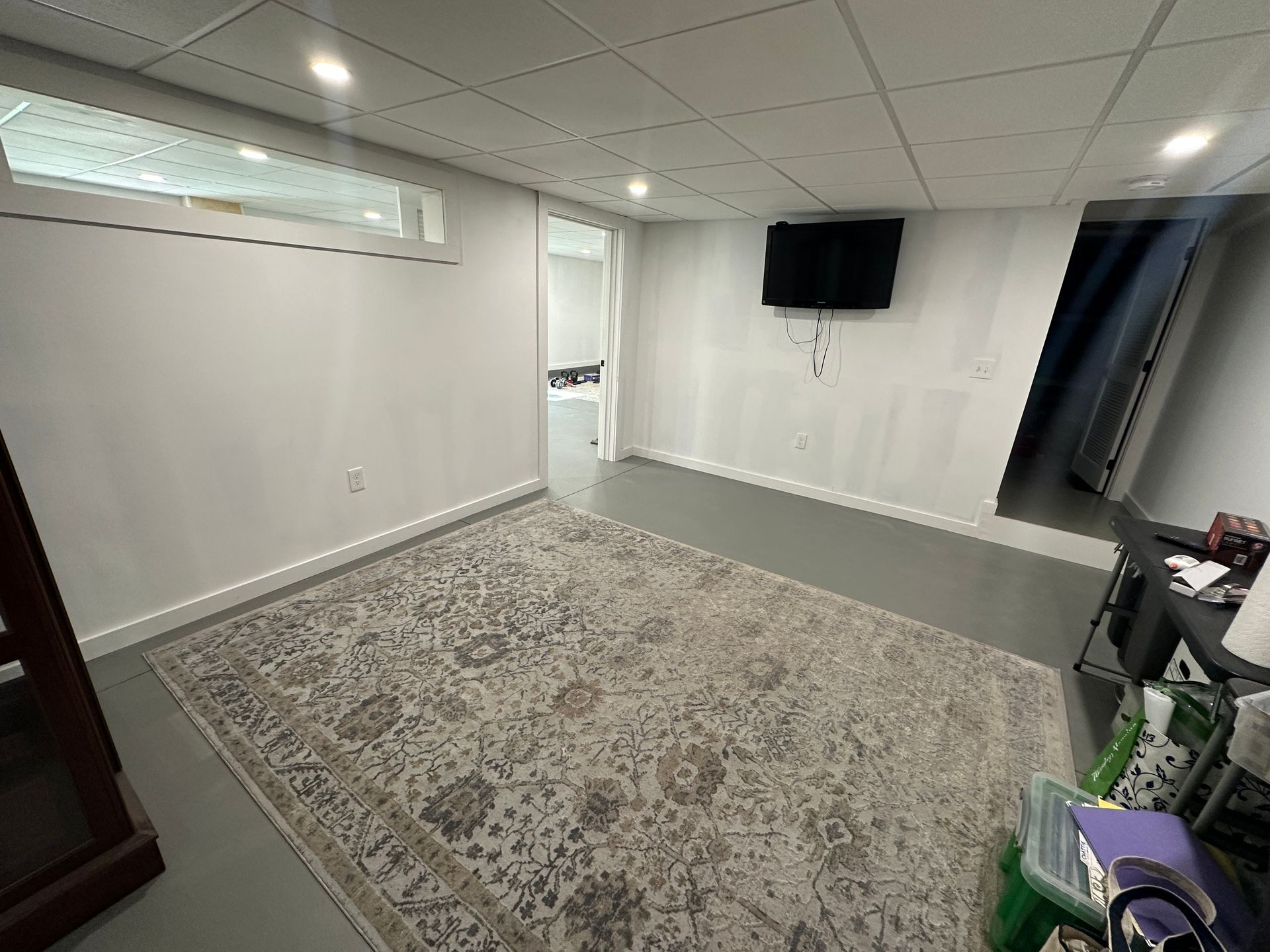An empty room with drywall on the walls and ceiling.
