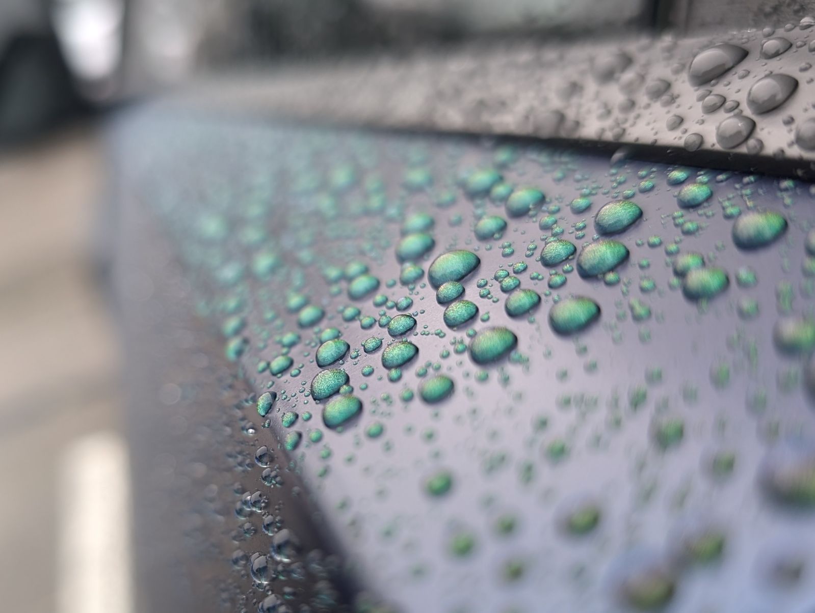 A close up of water drops on a Cybertruck ceramic coating