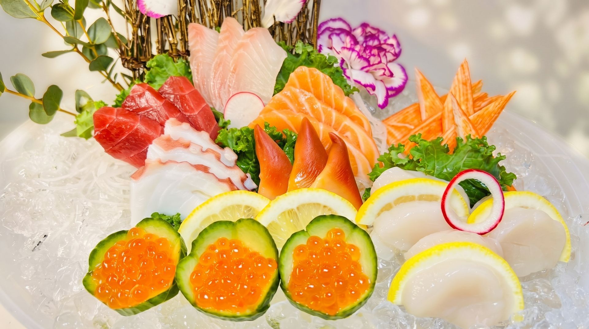 Assorted colorful sashimi and sushi arranged on crushed ice with garnishes and lemon slices