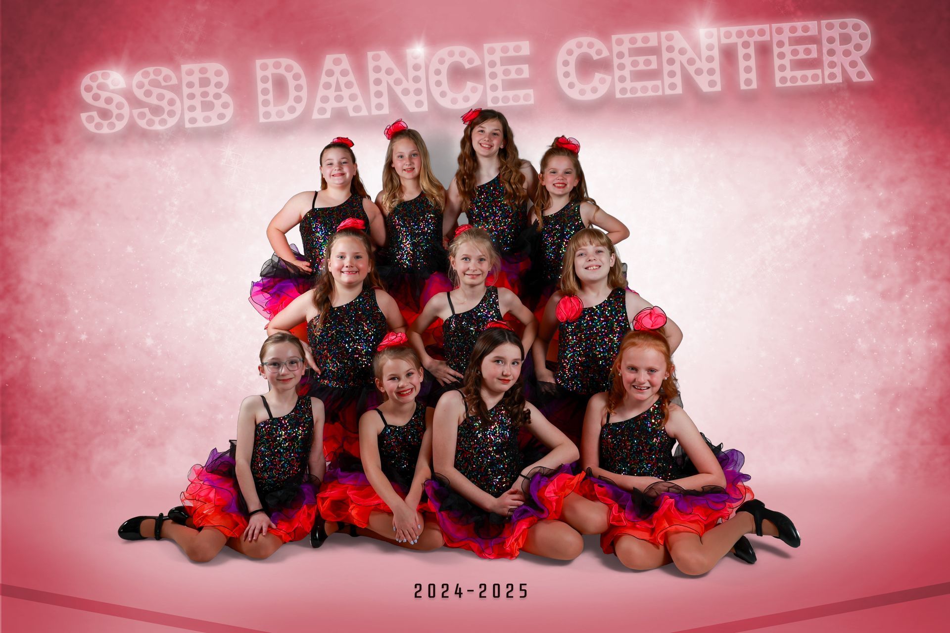 SSB Dance Center team in sequined black tops, colorful tutus, posing in a studio, 2024-2025.