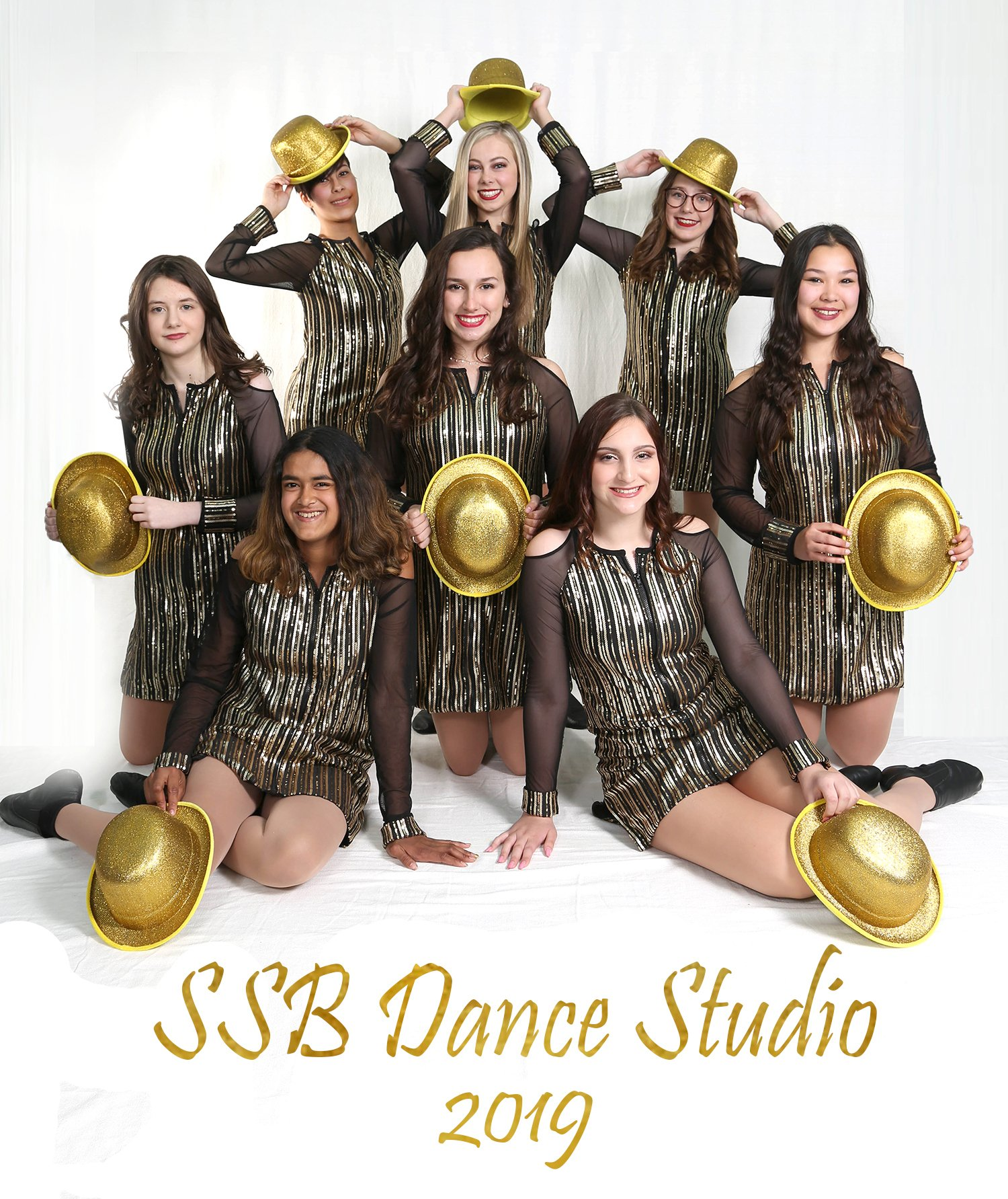 SSB Dance Studio 2019: Group of dancers in gold and black costumes, posing with hats.