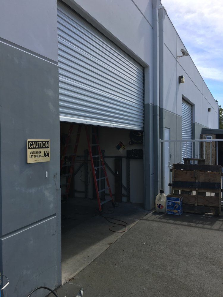 A garage door with a caution sign on it