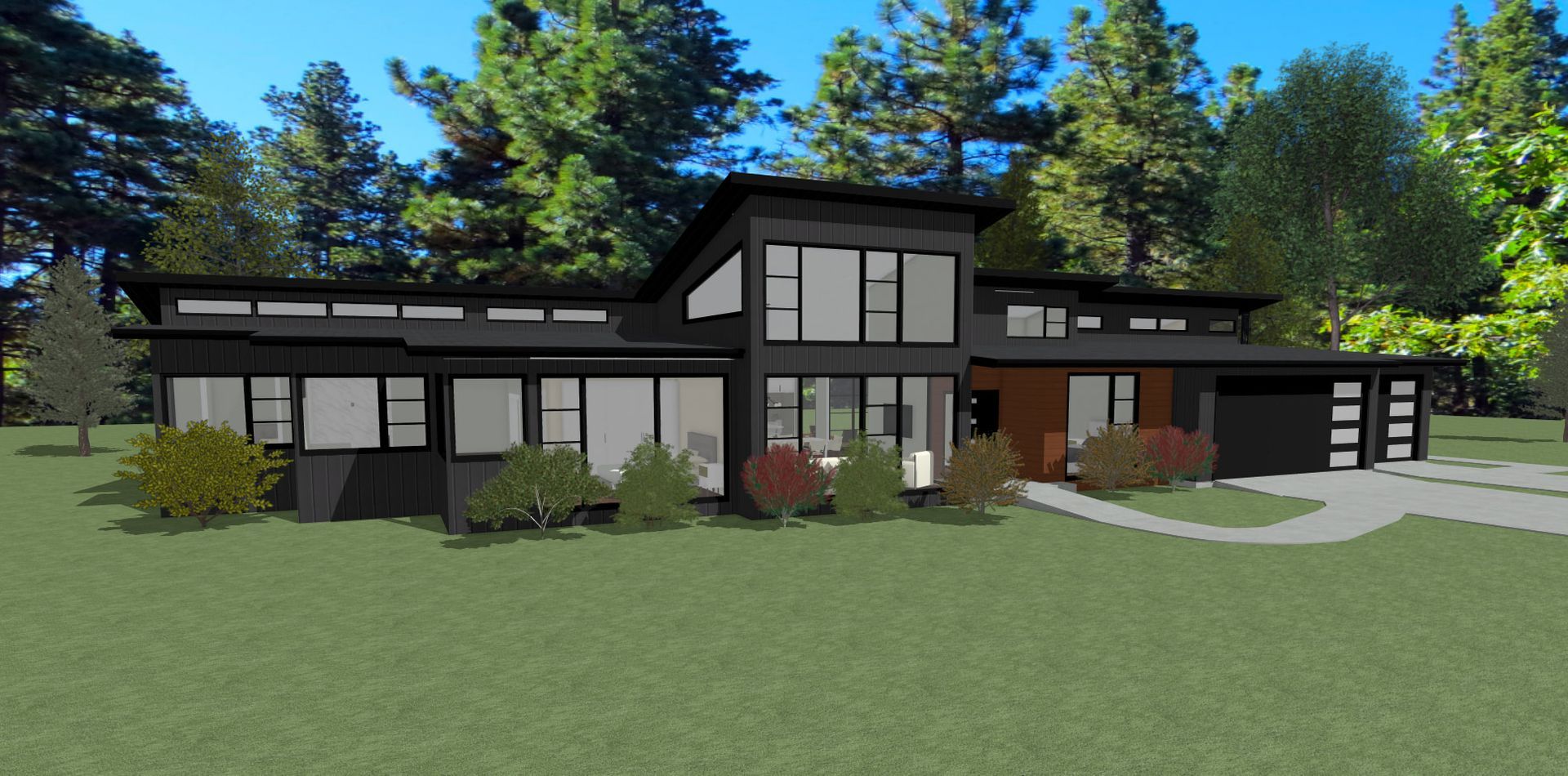A black house with a lot of windows is sitting on top of a lush green field.