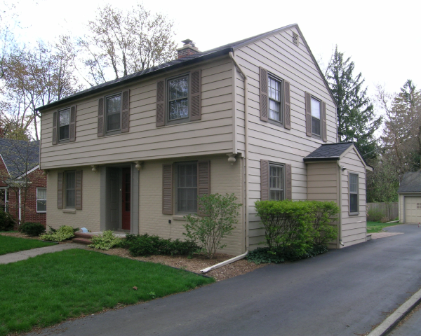 A house with a lot of windows and shutters