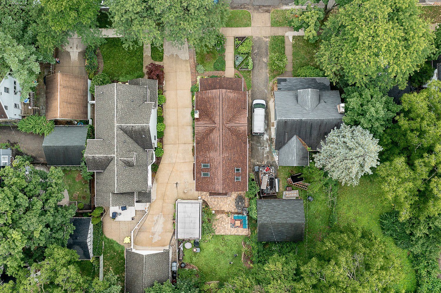 An aerial view of a residential area with lots of houses and trees.