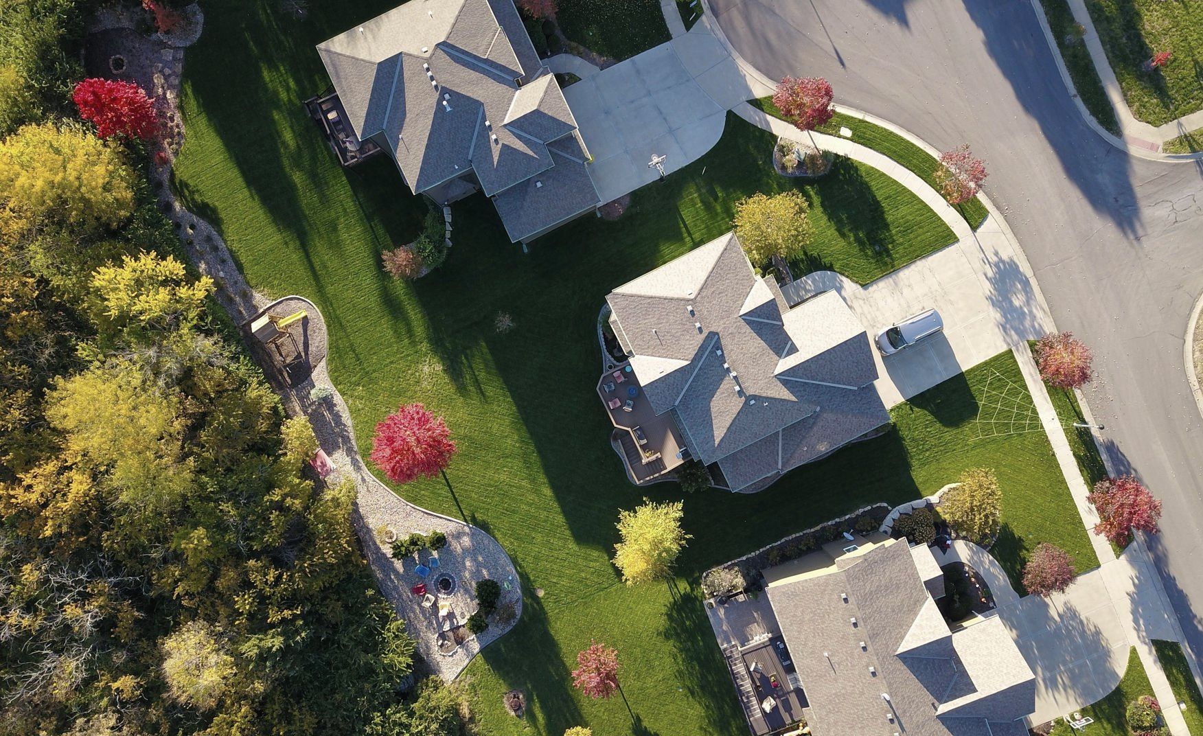 An aerial view of a residential neighborhood with houses and trees.