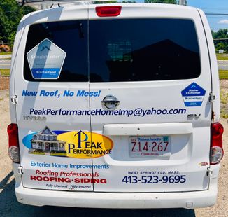 White van rear covered with Peak Performance Roofing & Siding ads and contact information. White van rear covered with Peak Performance Roofing & Siding ads and contact information.