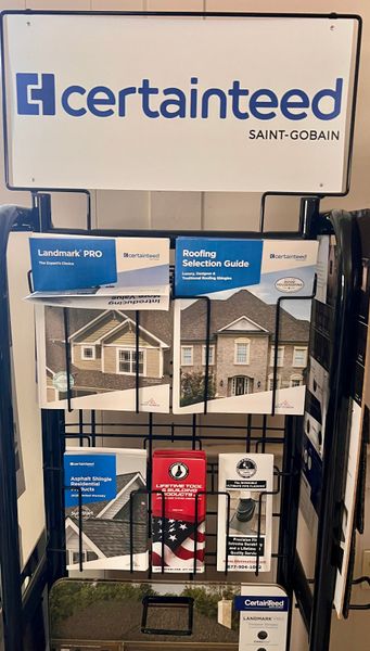 CertainTeed display rack with roofing and siding product brochures in a showroom CertainTeed display rack with roofing and siding product brochures in a showroom