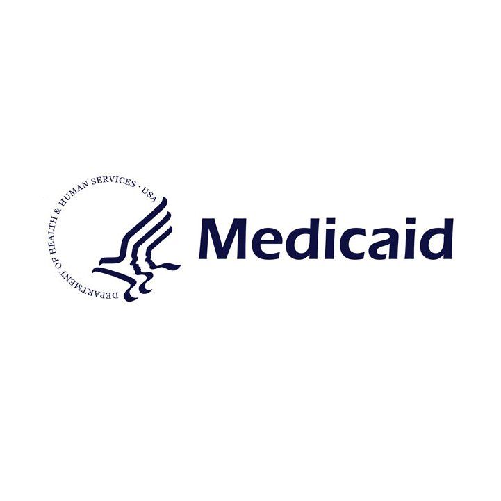 Medicaid logo in navy blue with stylized hands and circular seal text