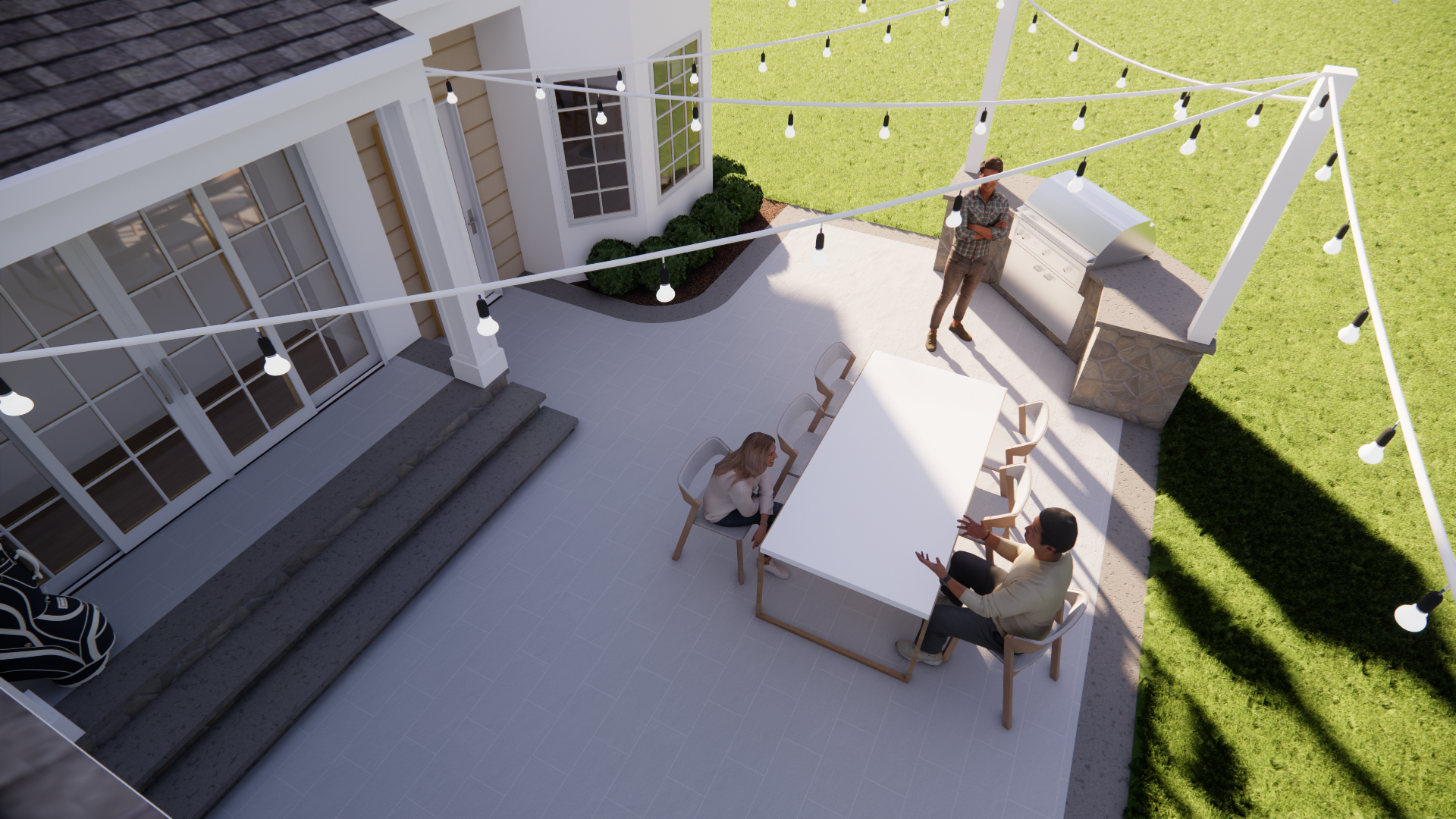 Rooftop patio with string lights, two people sitting and one standing near a white railing in bright sunlight
