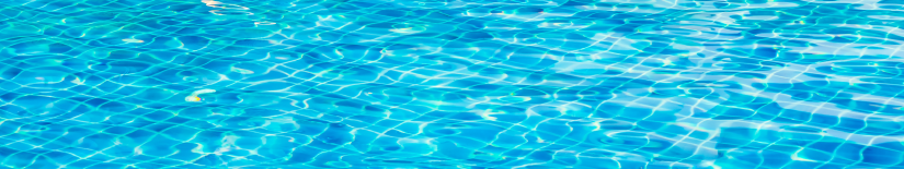Blue rippling water surface with sunlight reflections