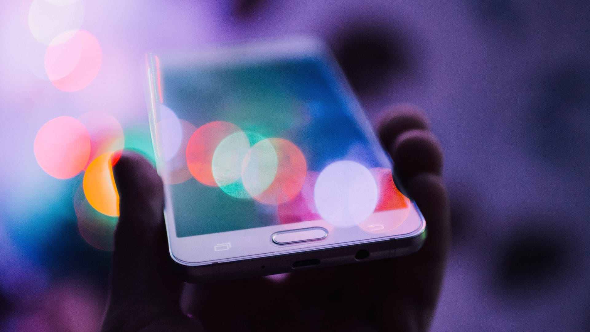 mobile phone being held in a person's hand
