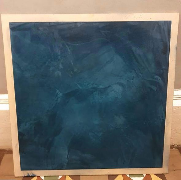 Board displaying navy blue plaster