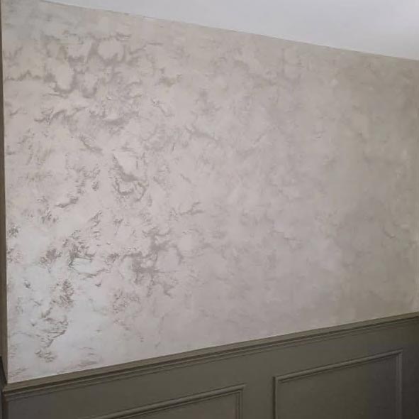 Wall with silver grey plaster and textured finish