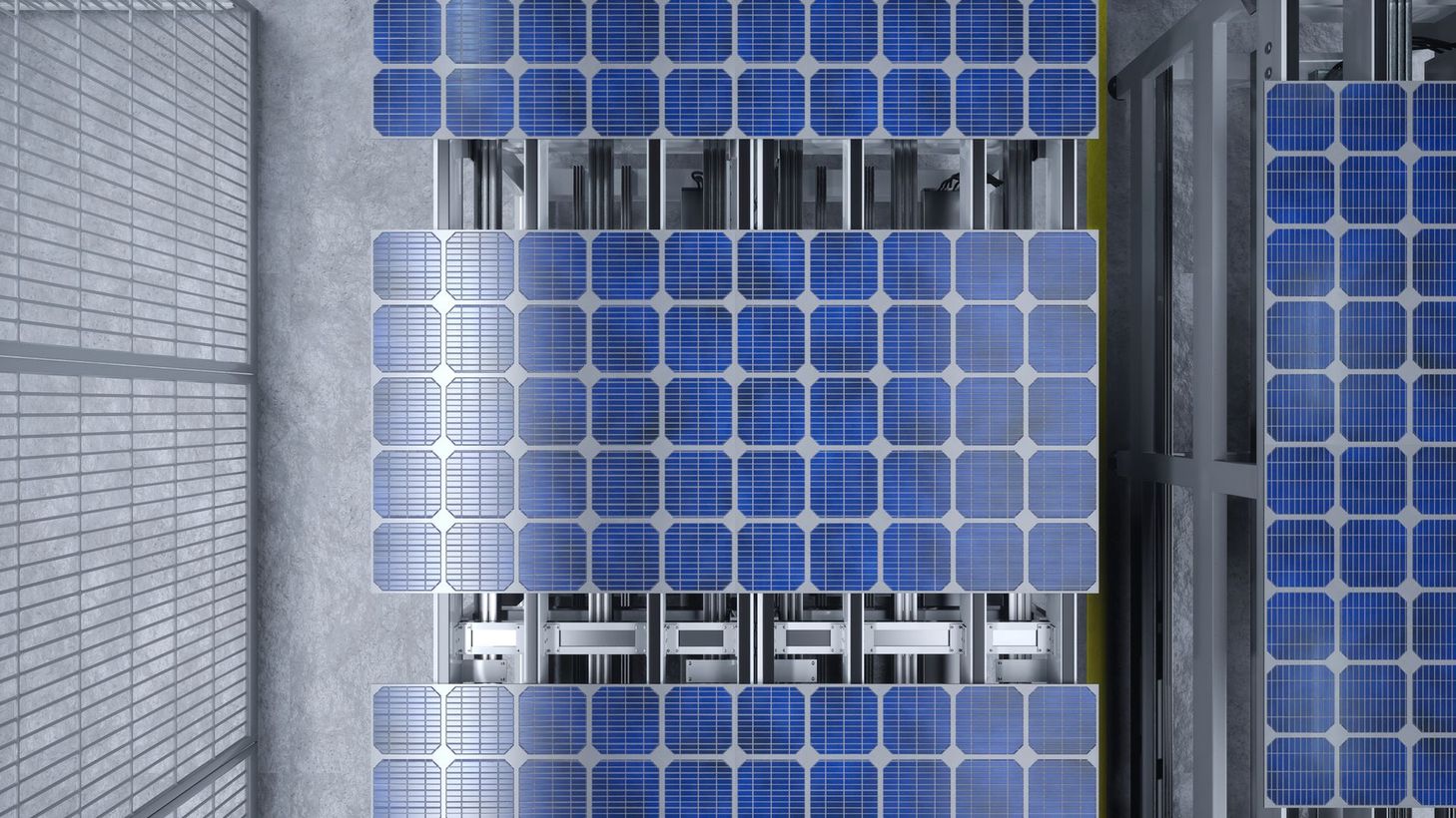 Veduta aerea di pannelli solari sul tetto di un edificio, con pannelli blu e strutture metalliche.