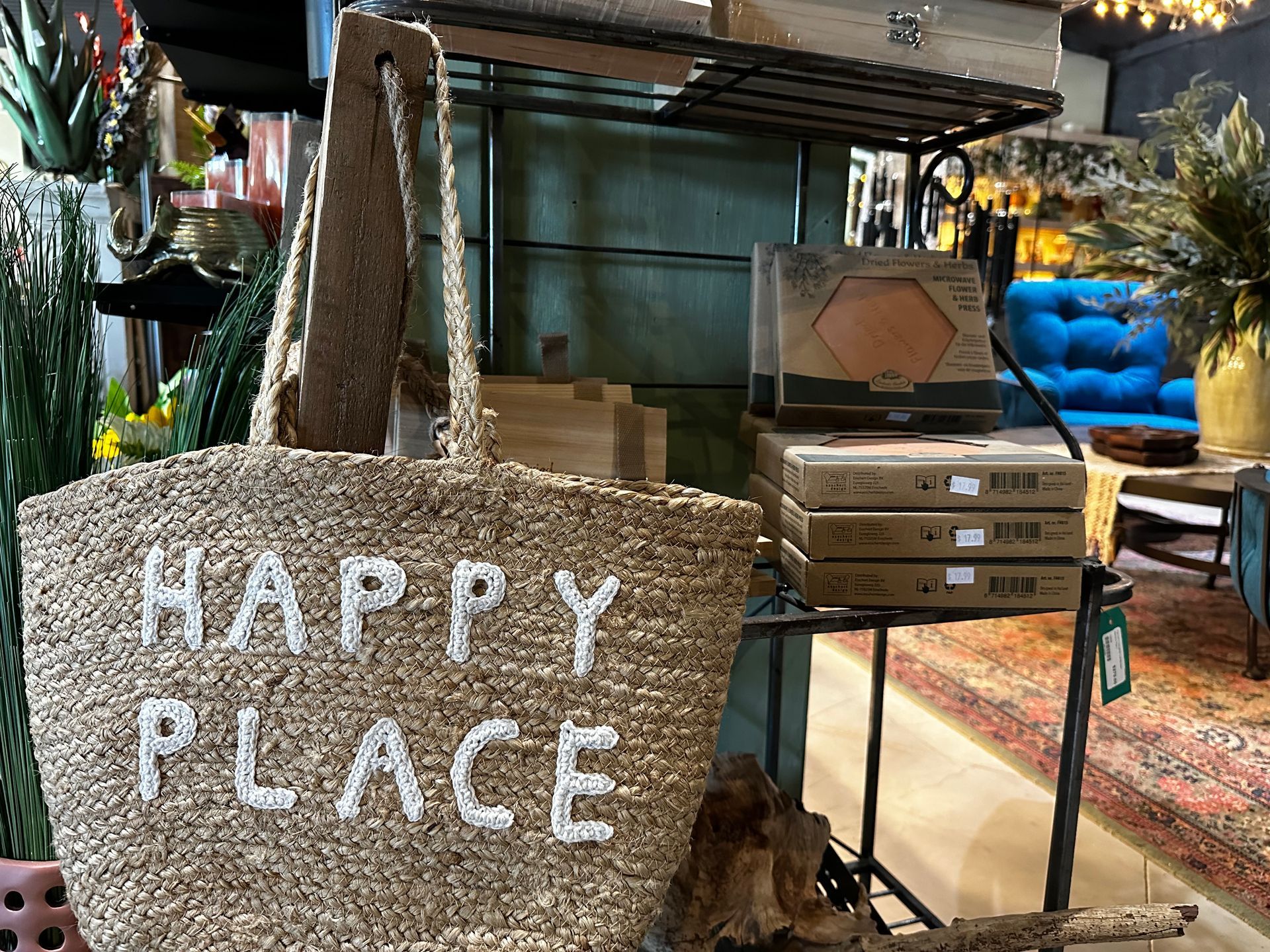 A wicker bag with the words `` happy place '' written on it