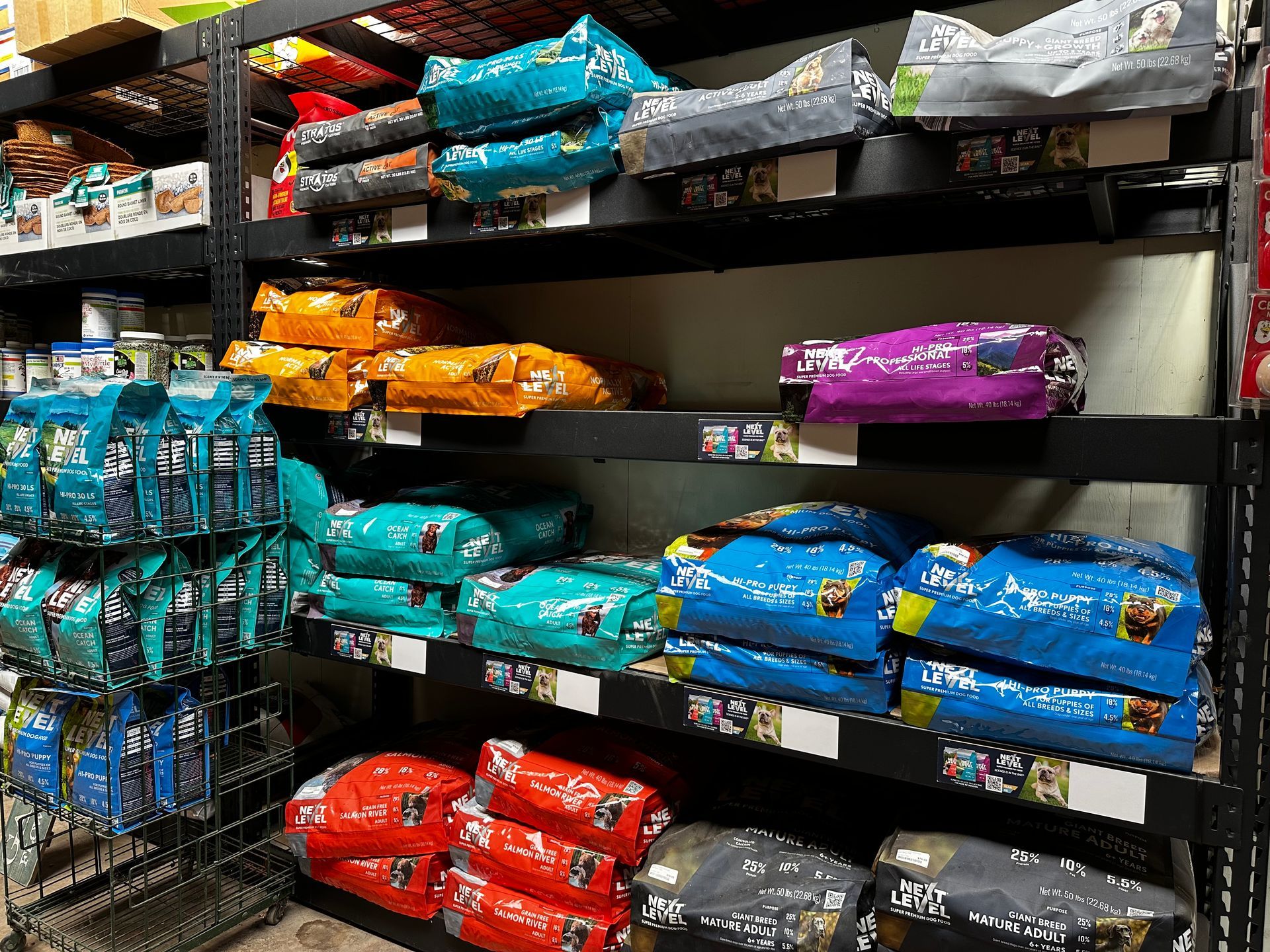 Shelves filled with bags of dog food in a store