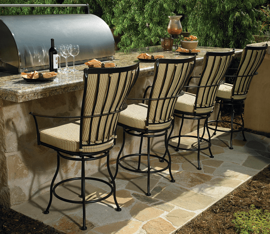 A row of chairs are lined up in front of a grill