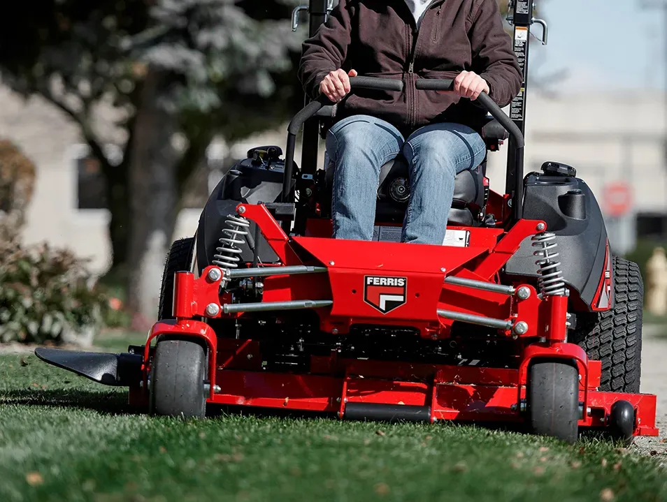 Man driving a Ferris Zero Turn Mower