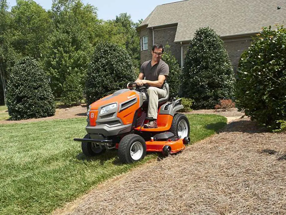 man driving a Husqvarna Tractor Mower
