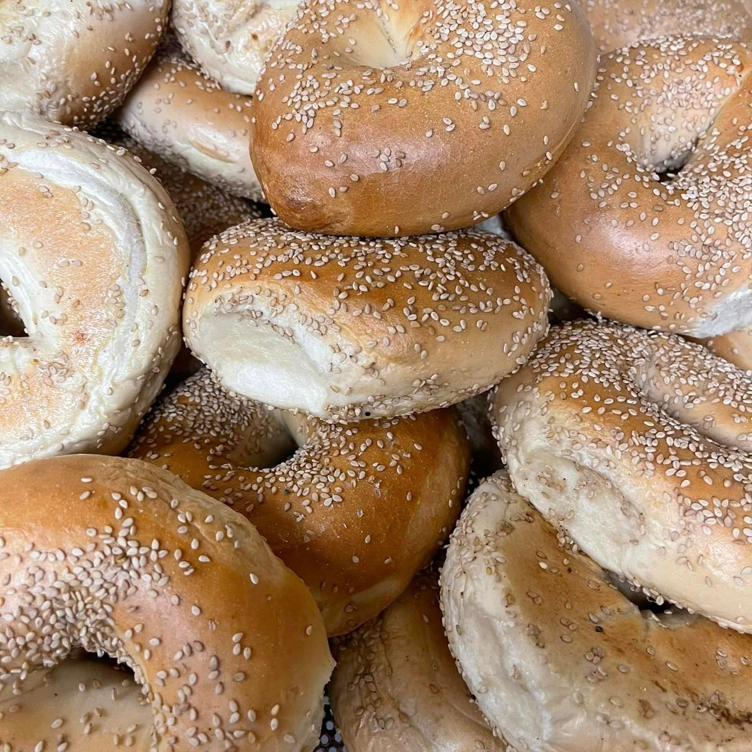 A Pile Of Bagels With Sesame Seeds On Them - Mahopac, NY - Our Town Bagels & Bakery A Pile Of Bagels With Sesame Seeds On Them - Mahopac, NY - Our Town Bagels & Bakery