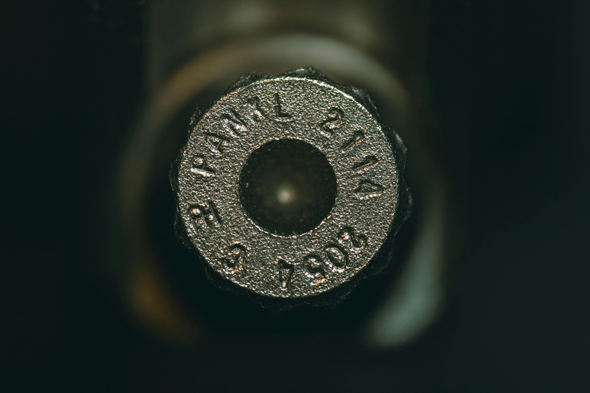 Close-up of ammunition. Induction machinery used for production.