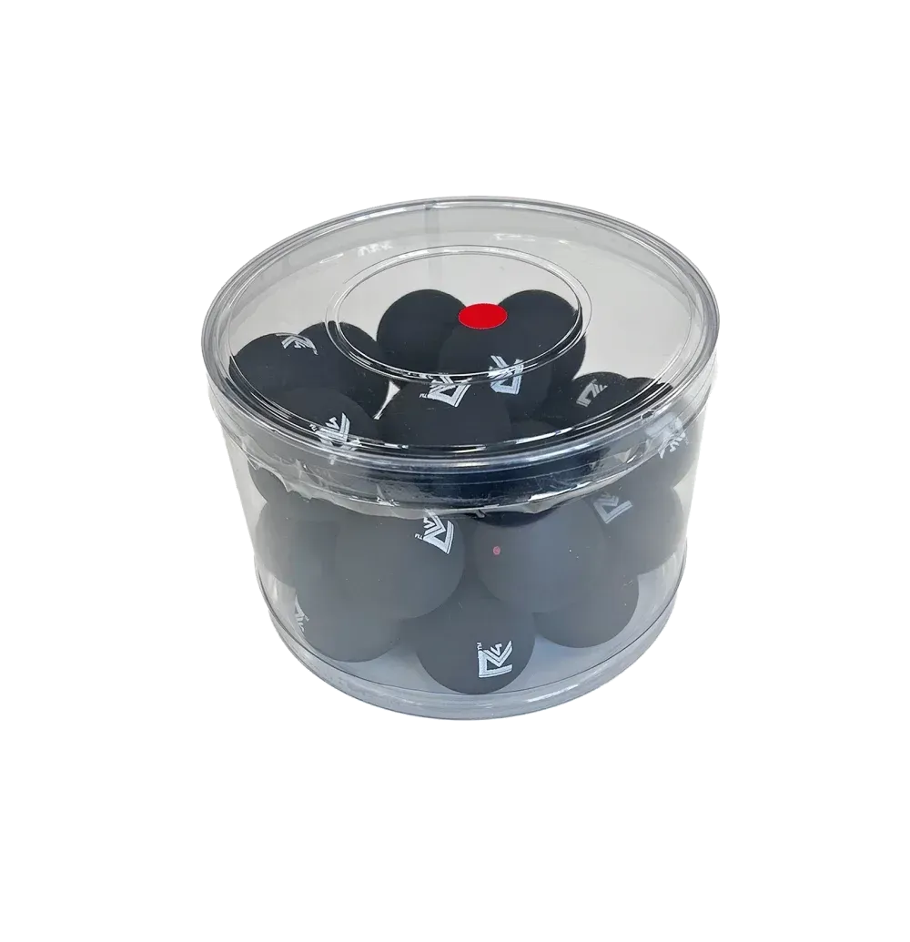 Black Squash balls in a clear plastic container, with a red dot on top of one.