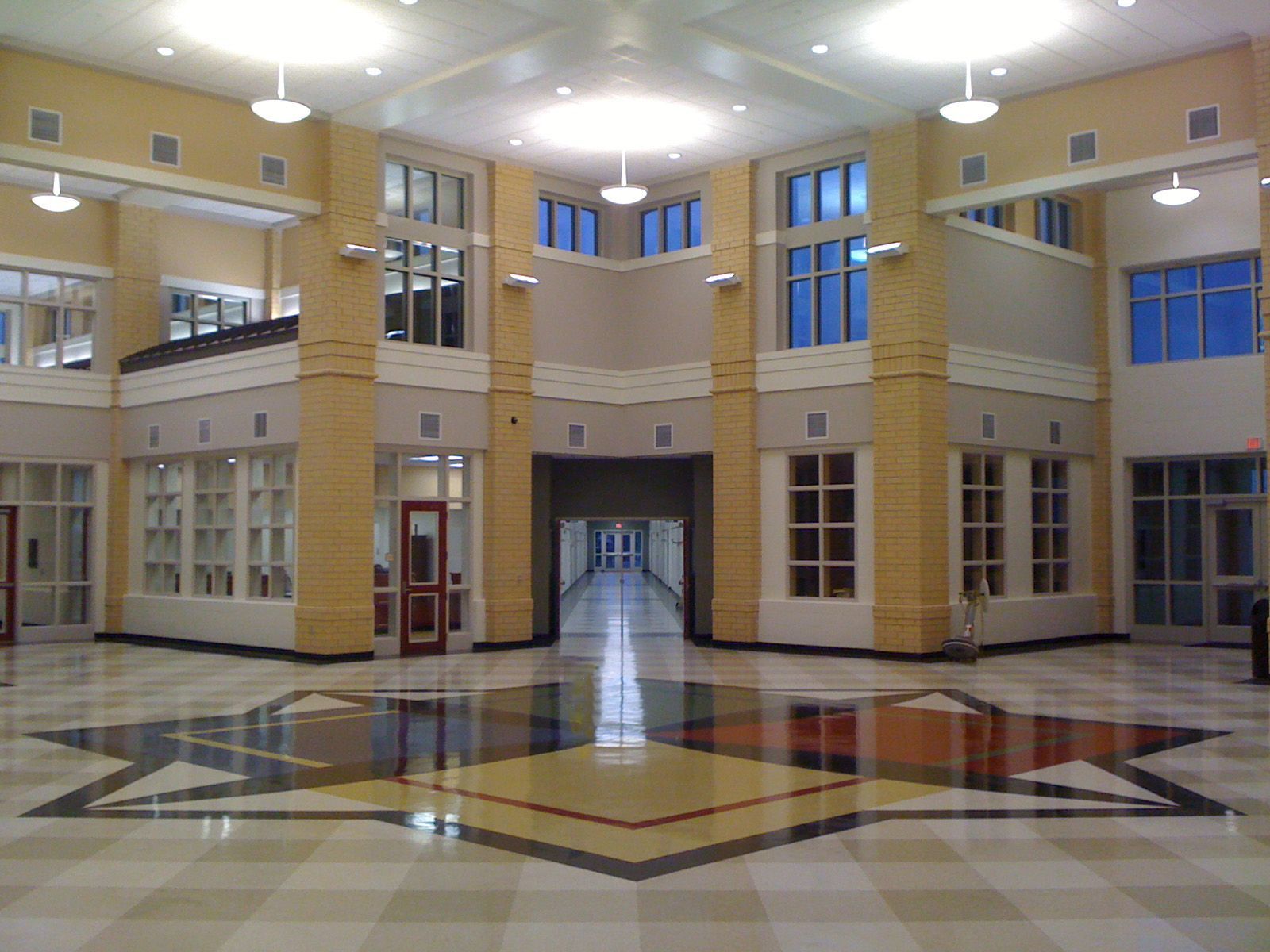 The atrium of middle school with blue, red, yellow, and green squares in the center