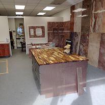 There is a large wooden table in the middle of the room.